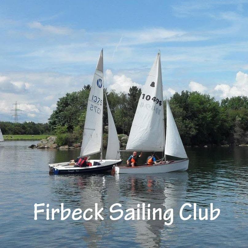 Two dinghies sailing on the lake at Rother Valley